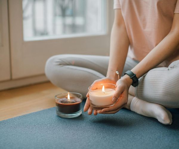 Serene person meditating in a pearl glow environment